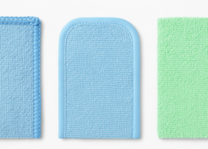 Blue textured microfiber pad for dish and surface cleaning with green cloth detail