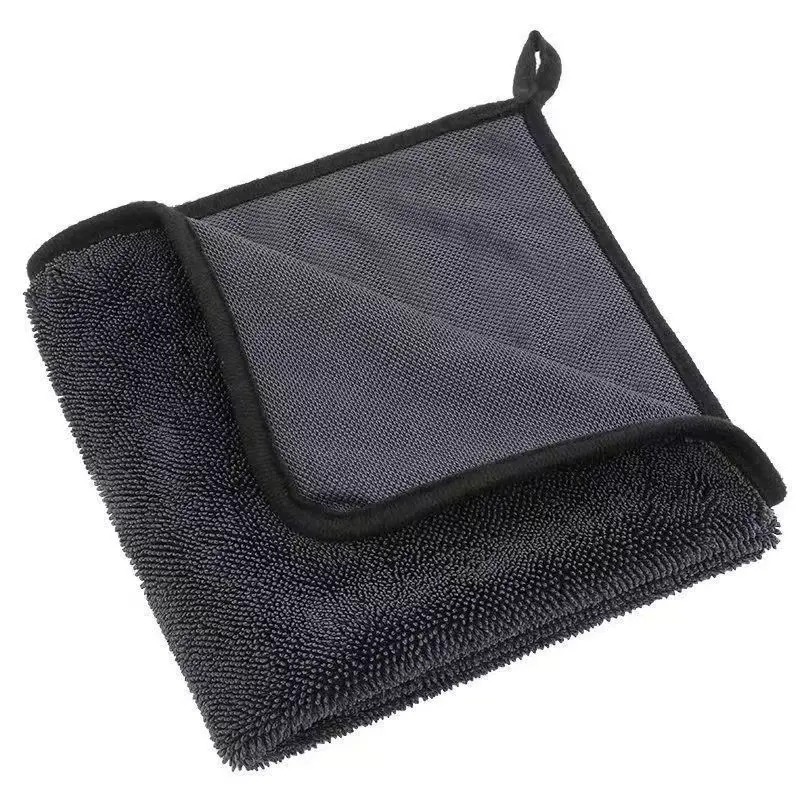 a large twist loop drying towel on the hood of a car