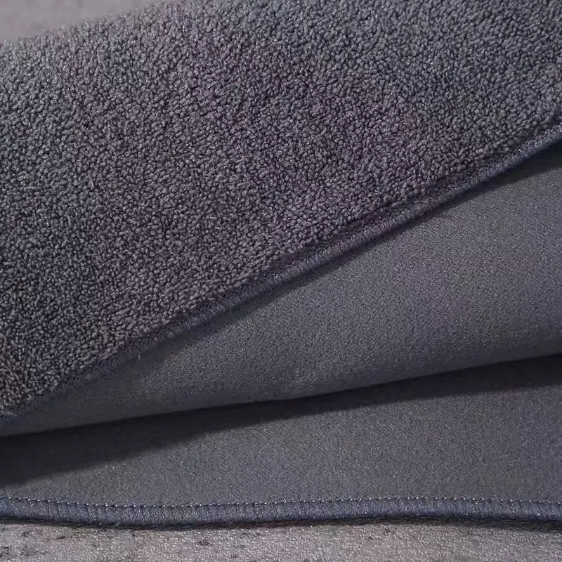Microfiber Cloth for Wax and Sealant Removal An edgeless, short-pile microfiber cloth buffing wax off a car door