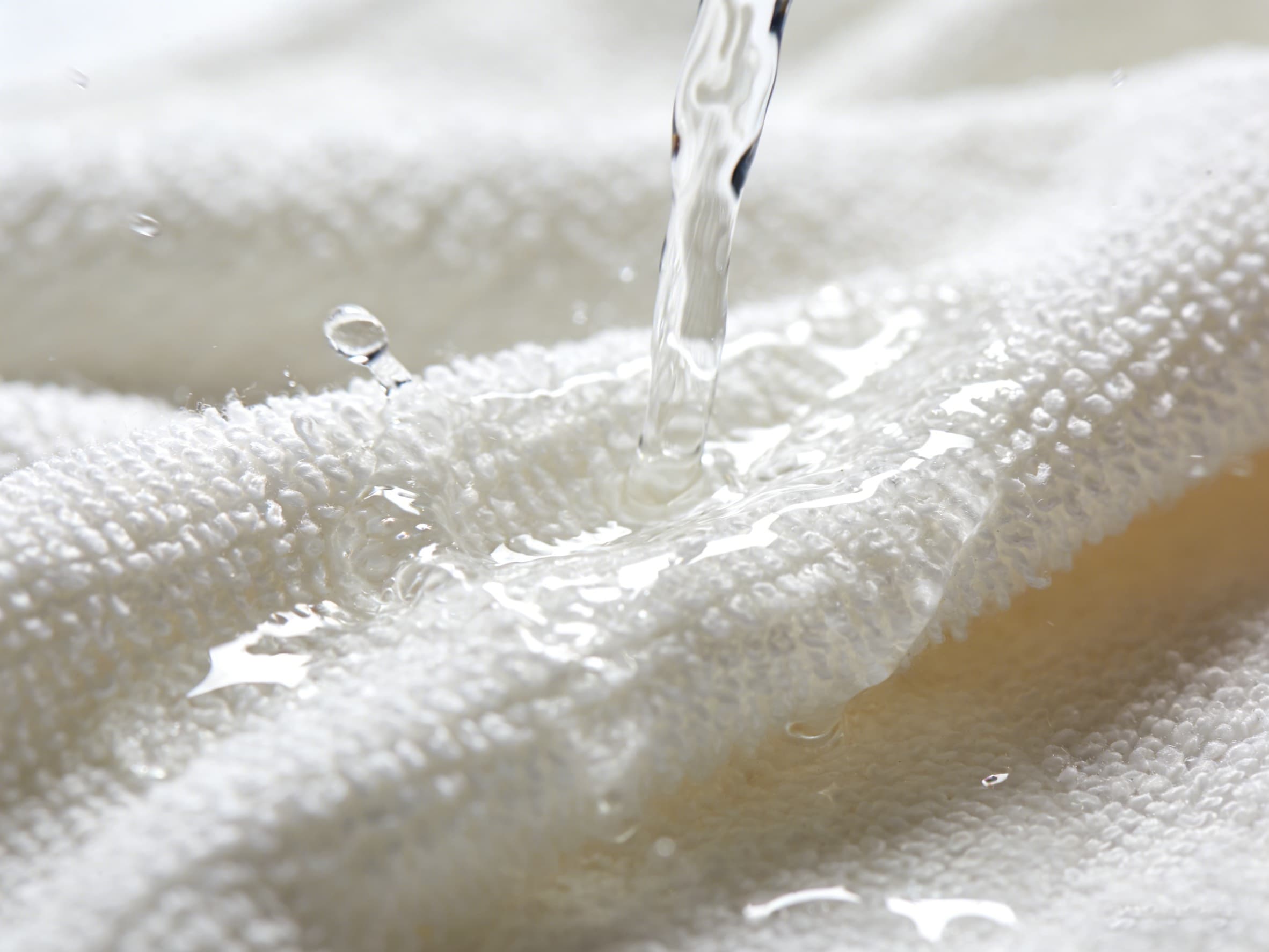 Microfiber Cloth Absorbing Water water being absorbed by a microfiber cloth