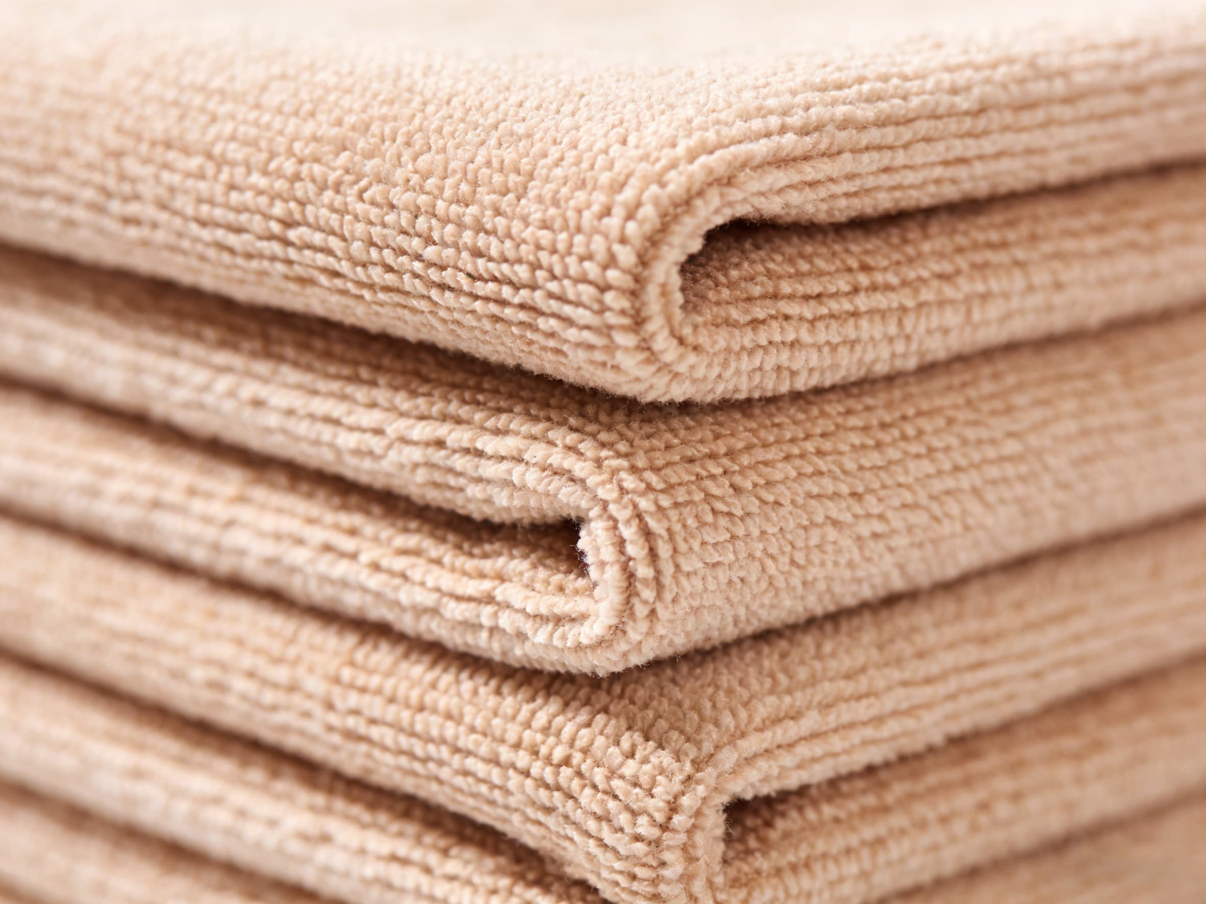 a stack of neatly folded, durable microfiber cloths