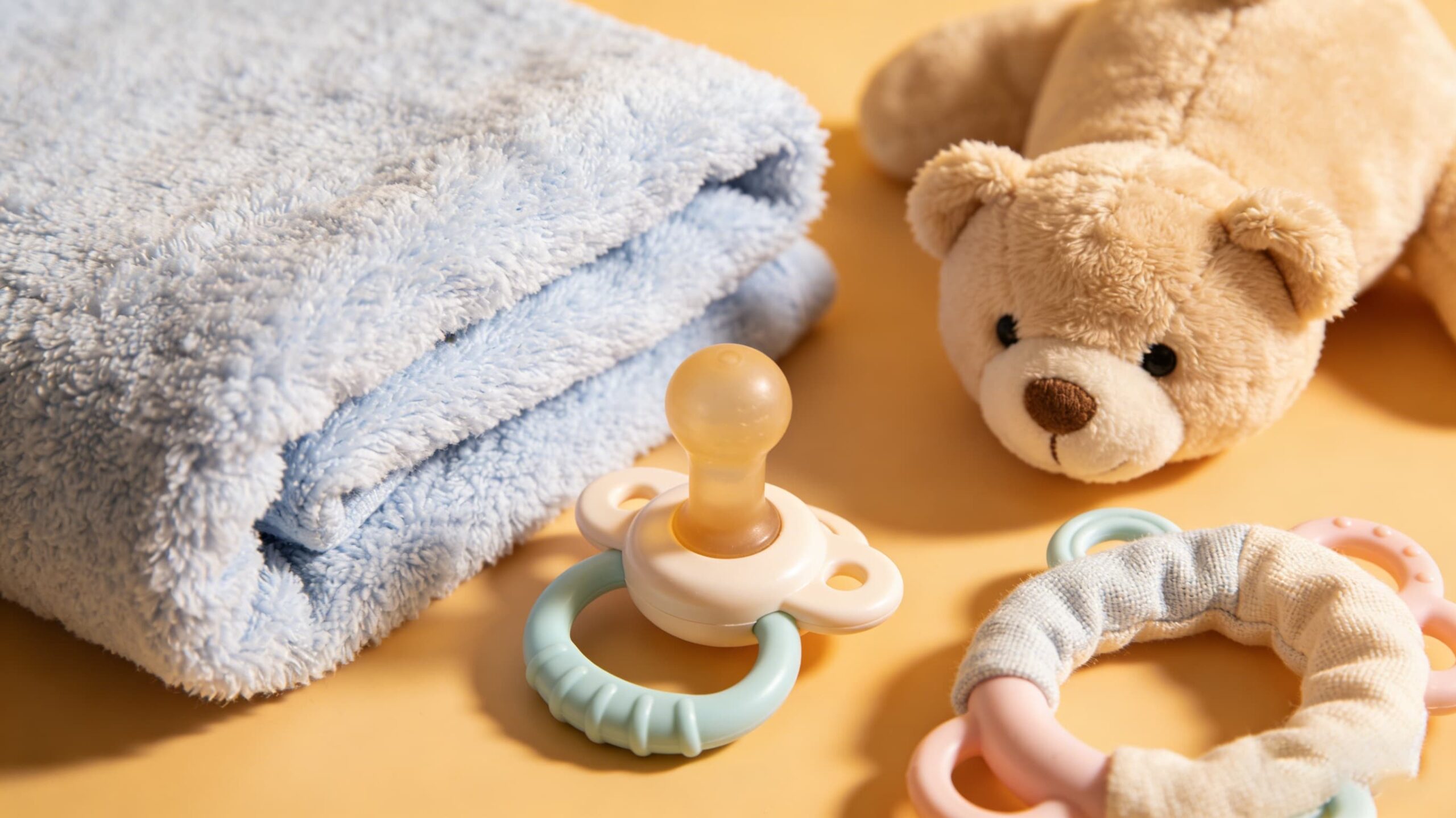 A soft microfiber cloth next to baby toys