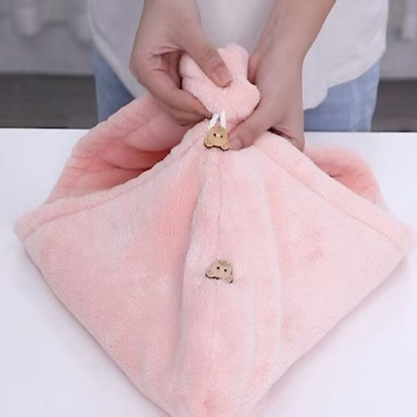 Light pink microfiber hanging towel with decorative bear embroidery and hanging loop